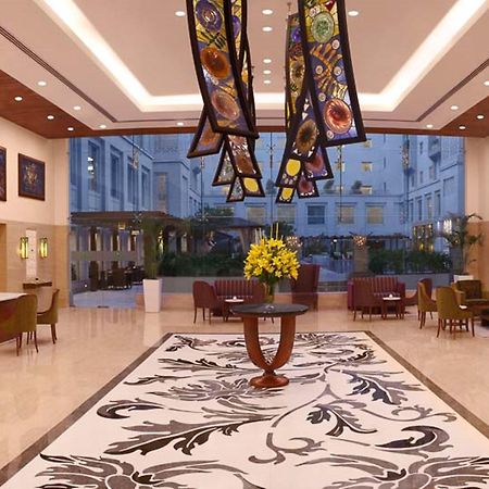 Lemon Tree Premier, Delhi Airport Hotel Új-Delhi Kültér fotó The lobby of the Taj Bengal